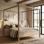 A light natural wood four-poster canopy bed styled in a warm, neutral-toned bedroom