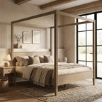 A light natural wood four-poster canopy bed with neutral beige bedding, styled in a warm, minimalist bedroom 
