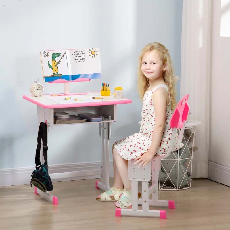 Child sitting at a pink and white desk with a chair in a room.