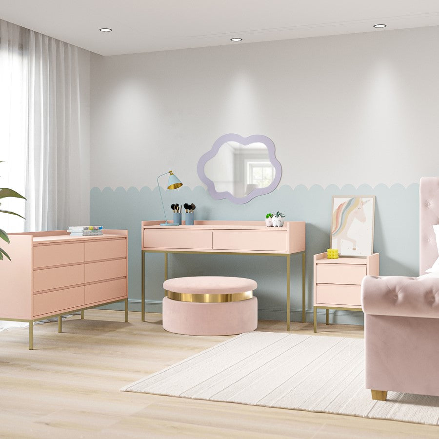 Modern bedroom with pink furniture including a dresser, vanity table, and chair.