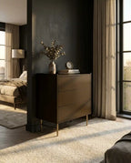 Modern bedroom with a dark wooden dresser against a dark wall.