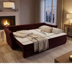 sofa bed with white mattress in a cozy living room setting.