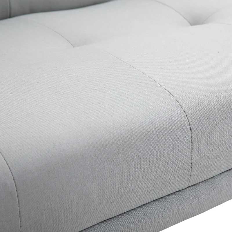 Close-up of a gray upholstered 3 seater sofabed
