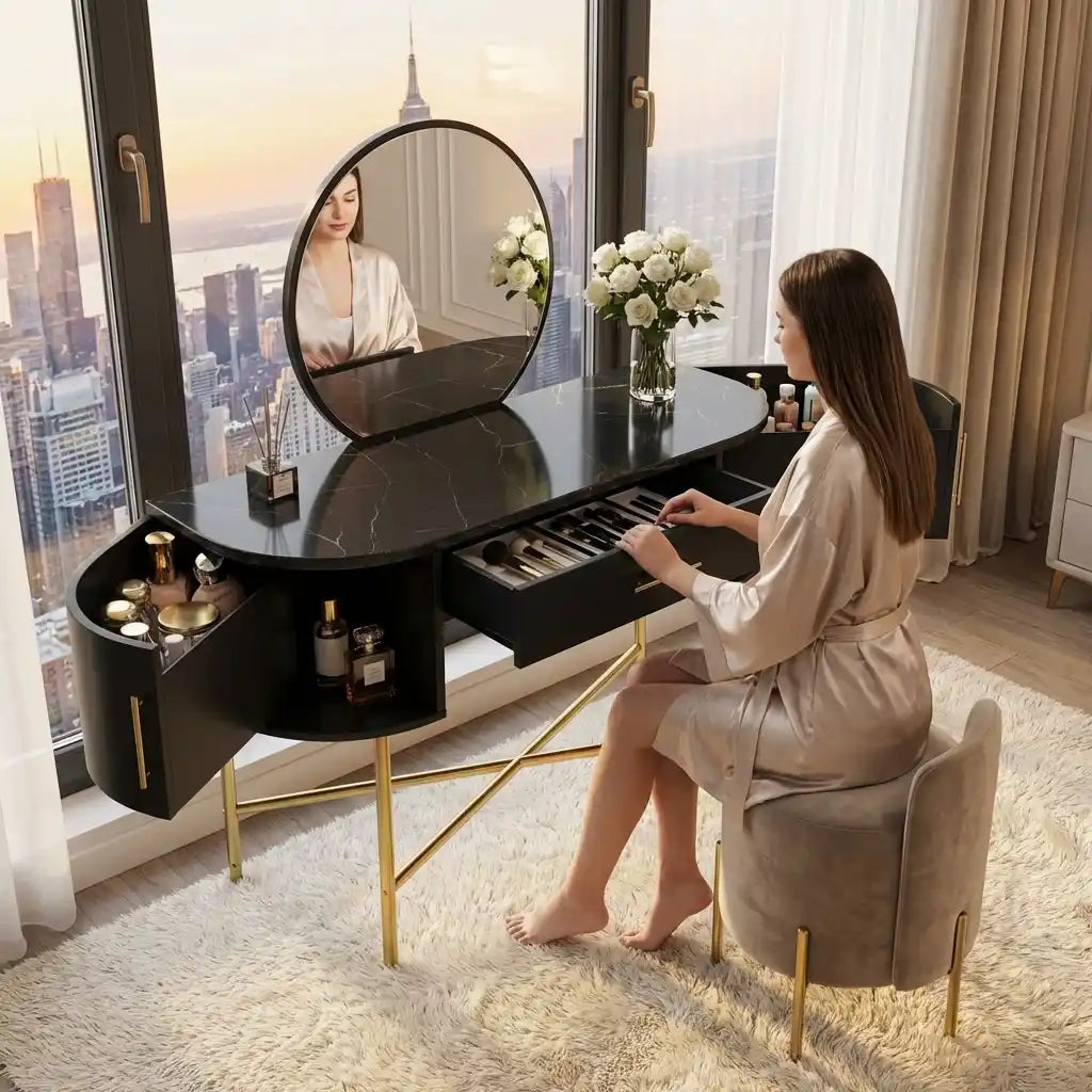 Woman sitting at a stylish vanity table with mirror and makeup items, in a room with large windows overlooking a cityscape.