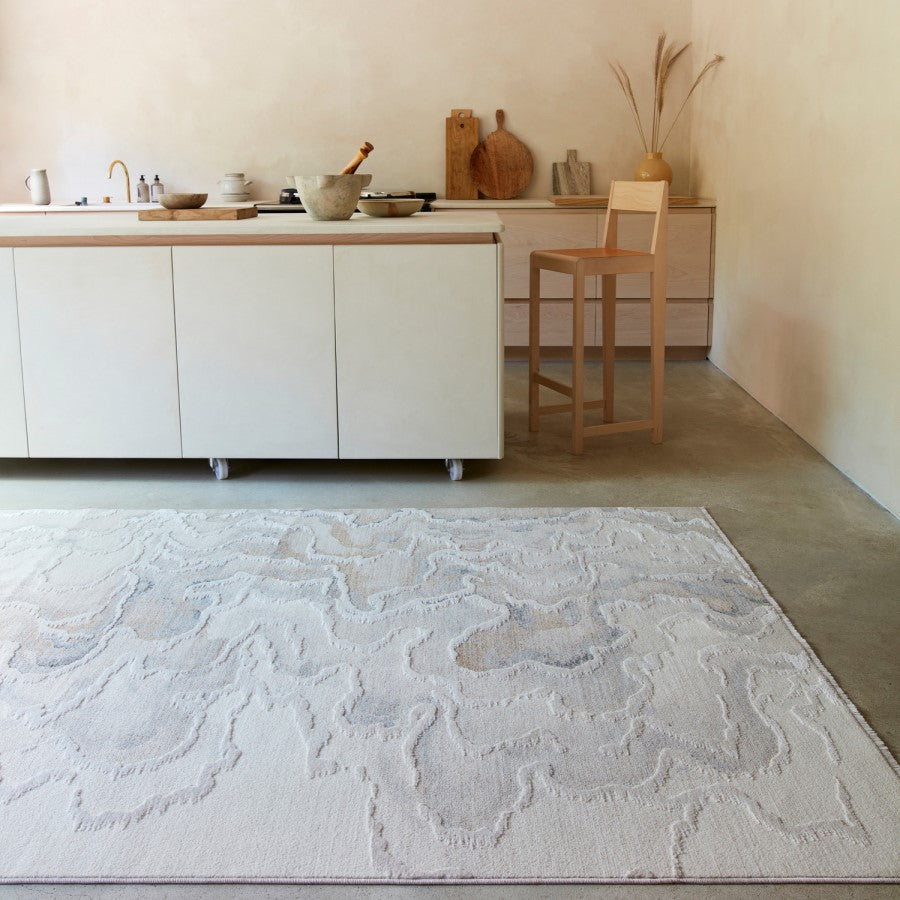 Kitchen with a textured rug on the floor