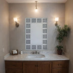 Bathroom with vanity, mirror, and decorative elements