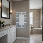 Modern bathroom with a vanity, mirror, and bathtub.