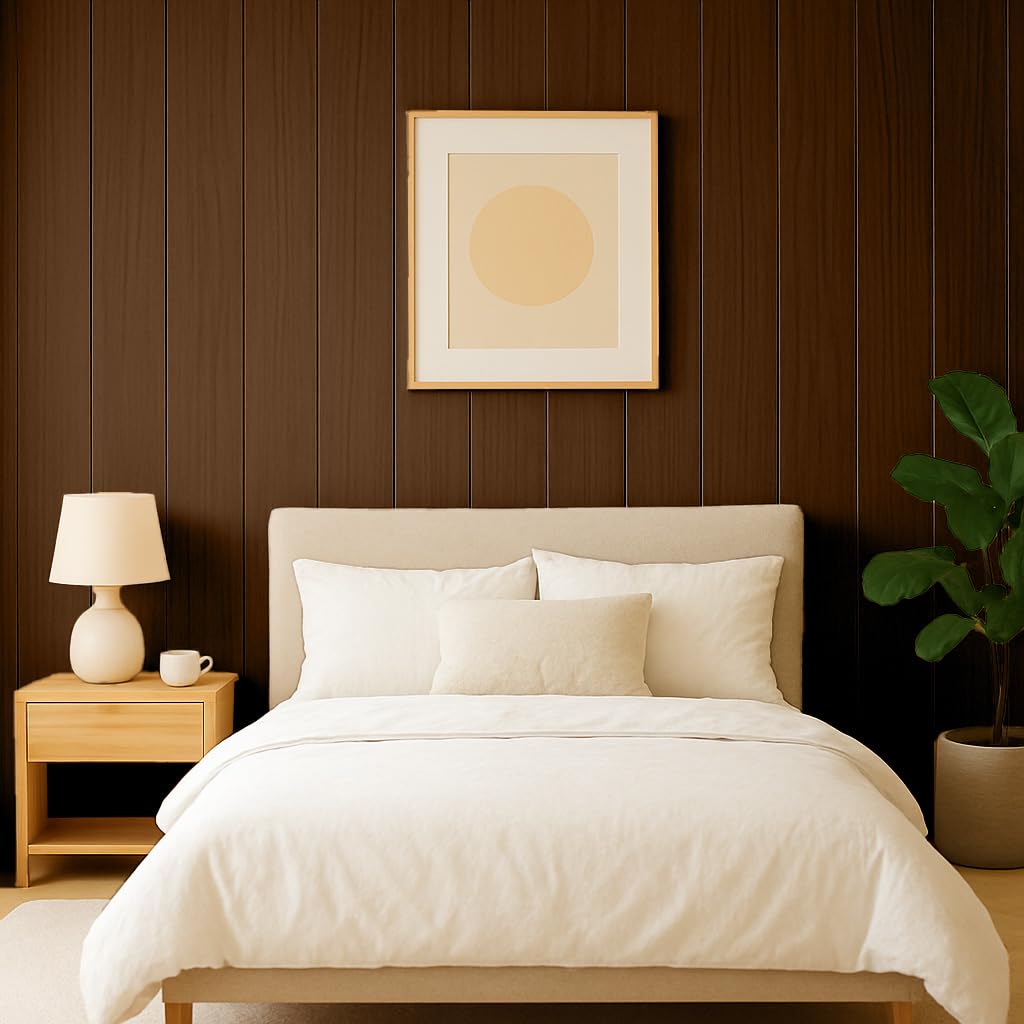 Neatly made bed in a bedroom with a wooden nightstand, lamp, and wall art.